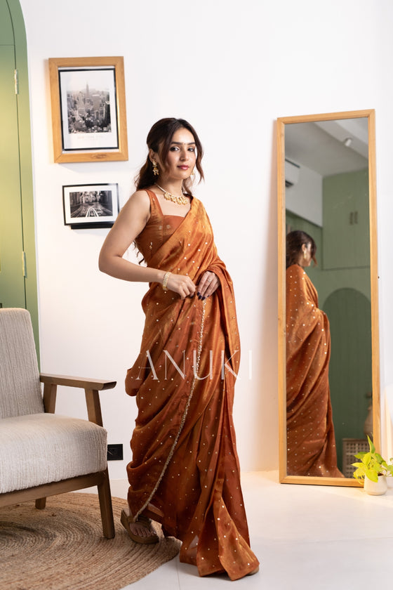 Shagun Rust Orange Tissue Silk Saree